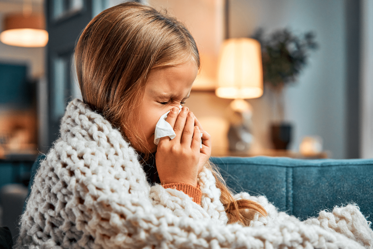 Small blonde girl with flu